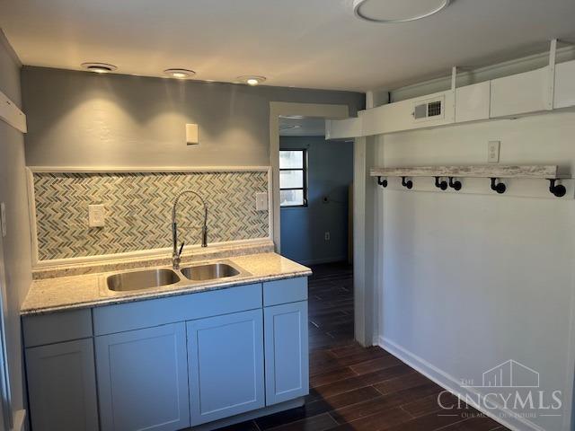 338 Wiltsee Ave, Miami Twp, OH 45140 - kitchen featuring dark wood-style floors and decorative backsplash