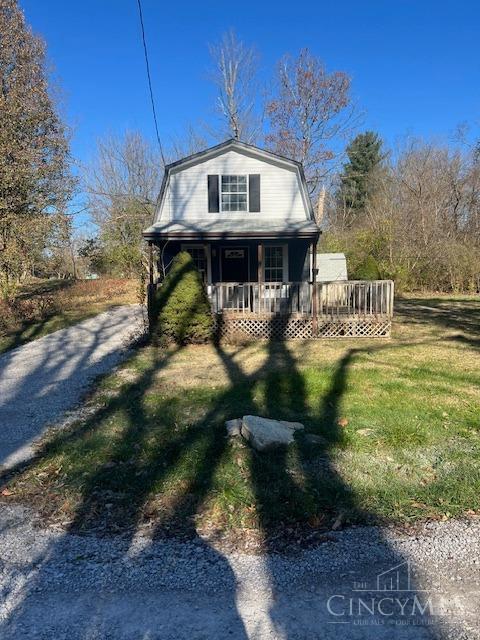 338 Wiltsee Ave, Miami Twp, OH 45140 - view of front facade with a gambrel roof, a front lawn, and a porch