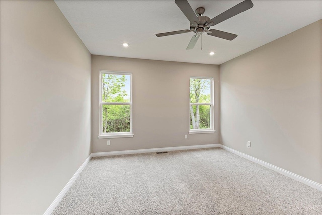 4517 Renaissance Park Dr, Middletown, OH 45005 - spare room with baseboards, plenty of natural light, light colored carpet, recessed lighting, and a ceiling fan
