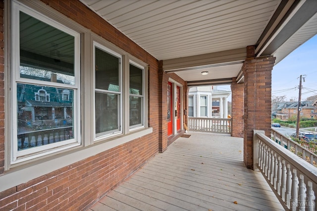 wooden terrace with a porch