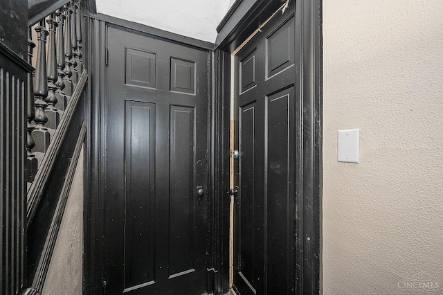 entryway with a textured wall