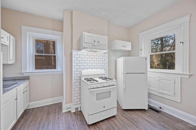 kitchen featuring white appliances, dark wood-type flooring, and white cabinetry