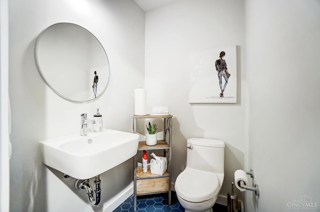bathroom featuring tile patterned flooring and toilet