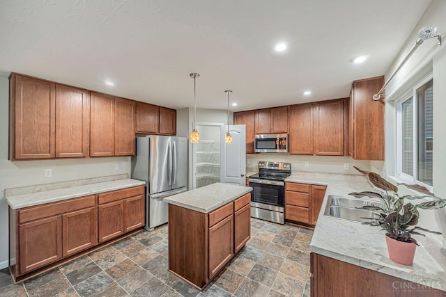 1295 Eagle Blvd, Hamilton Twp, OH 45039 - kitchen featuring stainless steel appliances, brown cabinetry, a center island, a sink, and light countertops