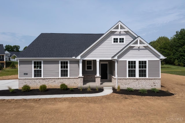 4147 Amelia Olive Branch Rd, Batavia Twp, OH 45103 - craftsman house with brick siding, a porch, and roof with shingles