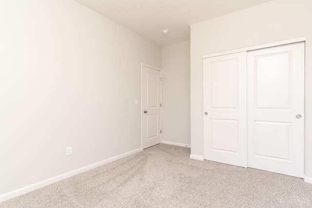 4147 Amelia Olive Branch Rd, Batavia Twp, OH 45103 - unfurnished bedroom featuring light carpet, baseboards, and a closet