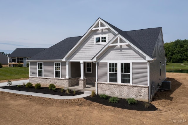 4147 Amelia Olive Branch Rd, Batavia Twp, OH 45103 - craftsman-style home featuring central AC unit, brick siding, covered porch, and a shingled roof