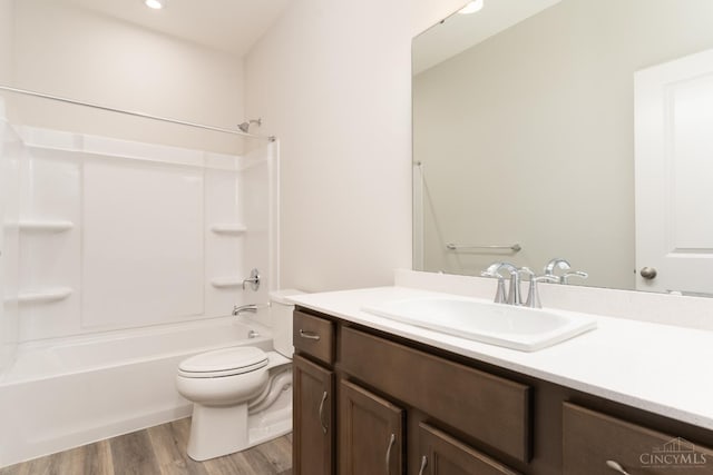 4147 Amelia Olive Branch Rd, Batavia Twp, OH 45103 - bathroom featuring toilet, vanity, wood finished floors, and shower / washtub combination