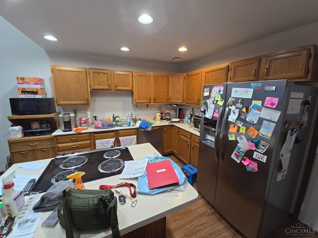 kitchen featuring sink, dark wood-type flooring, and stainless steel appliances