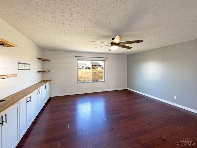 1789 Greentree Meadows Dr, Turtle Creek Twp, OH 45036 - spare room featuring dark wood finished floors, a textured ceiling, baseboards, and ceiling fan