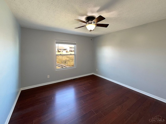 1789 Greentree Meadows Dr, Turtle Creek Twp, OH 45036 - empty room featuring visible vents, baseboards, ceiling fan, dark wood-style flooring, and a textured ceiling