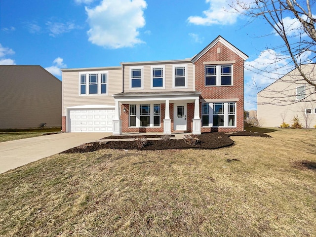 1789 Greentree Meadows Dr, Turtle Creek Twp, OH 45036 - view of front of house featuring an attached garage, covered porch, brick siding, concrete driveway, and a front yard