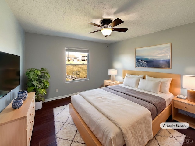 1789 Greentree Meadows Dr, Turtle Creek Twp, OH 45036 - bedroom featuring a textured ceiling, wood finished floors, a ceiling fan, and baseboards