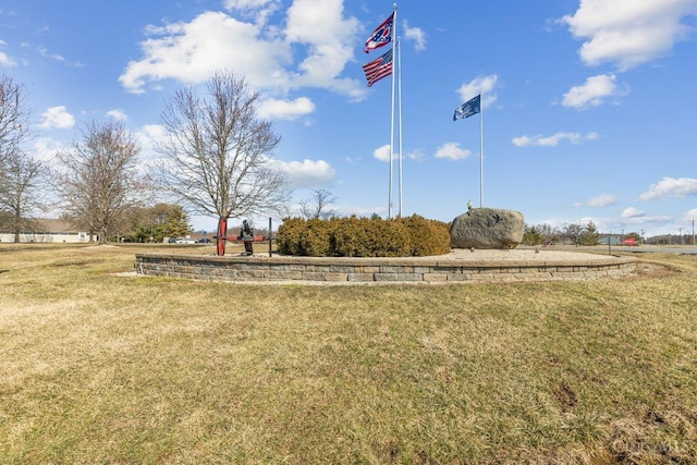 view of home's community featuring a lawn