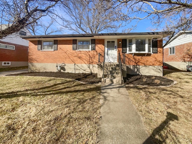 3044 Aries Ct, Colerain Twp, OH 45251 - single story home with brick siding, entry steps, and a front yard