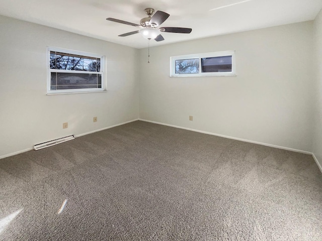 3044 Aries Ct, Colerain Twp, OH 45251 - spare room with baseboard heating, dark colored carpet, and a ceiling fan