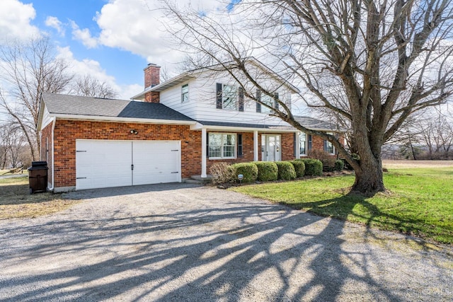 traditional-style house featuring a front lawn, driveway, a garage, brick siding, and a chimney