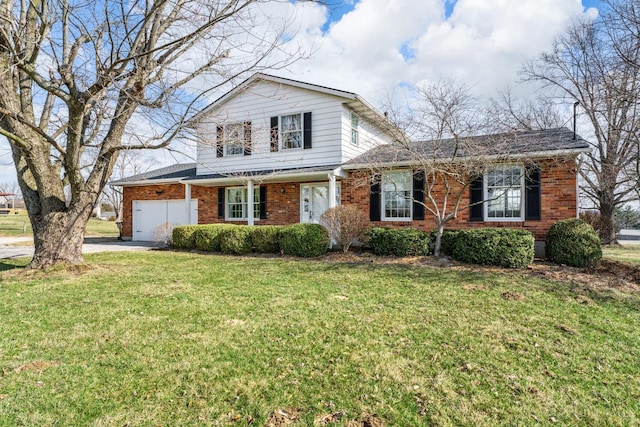 traditional home featuring driveway, brick siding, an attached garage, and a front yard