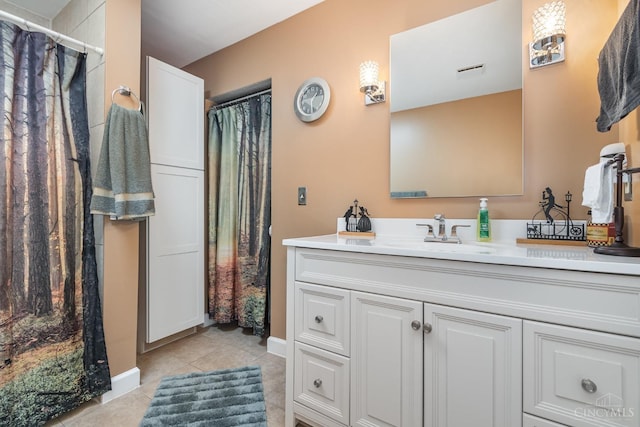 full bath with tile patterned floors, vanity, a shower with shower curtain, and baseboards