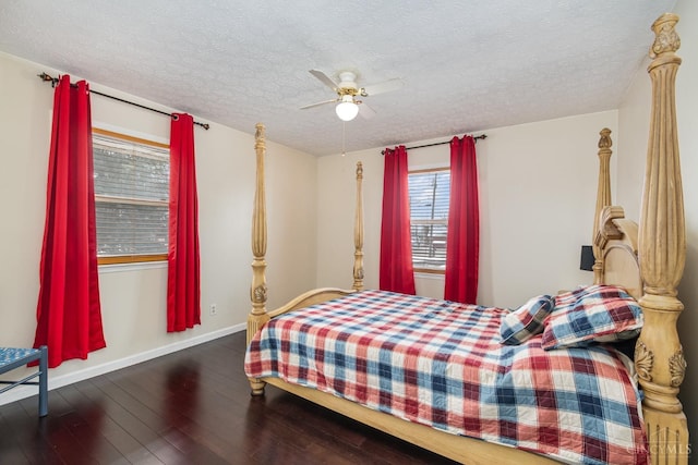 bedroom featuring a textured ceiling, hardwood / wood-style floors, baseboards, and ceiling fan
