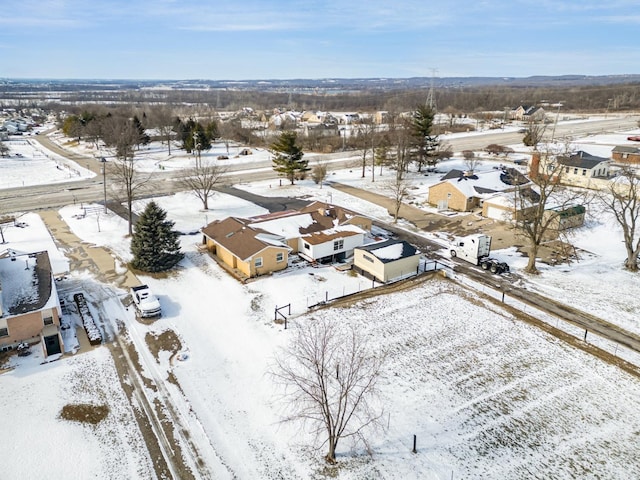 snowy aerial view featuring a residential view