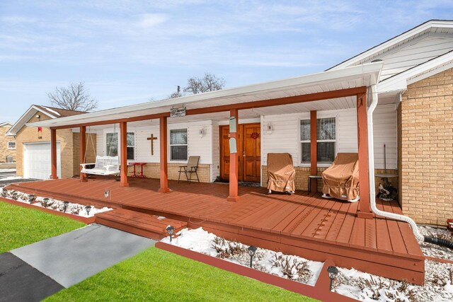 wooden deck with a garage