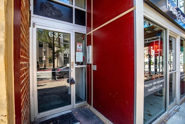 entrance to property with brick siding