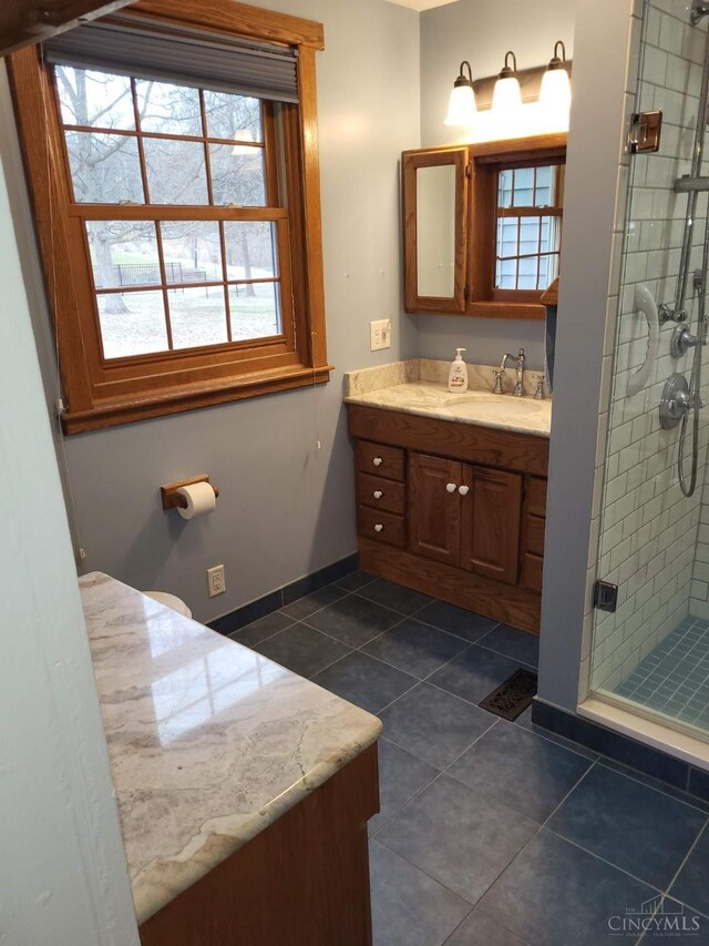 1144 Round Bottom Rd, Union Twp, OH 45150 - bathroom with a shower stall, baseboards, tile patterned flooring, and vanity