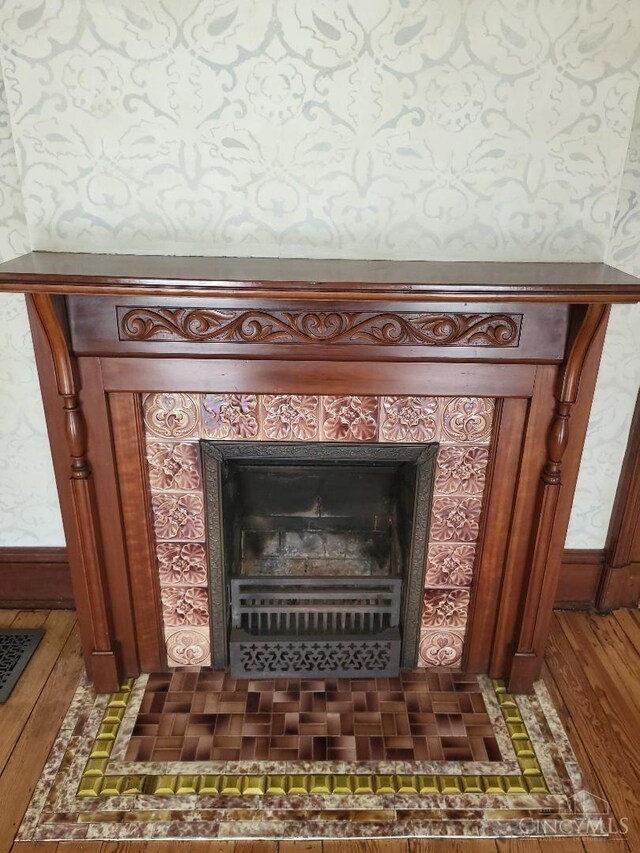1144 Round Bottom Rd, Union Twp, OH 45150 - room details featuring a tiled fireplace and wood finished floors