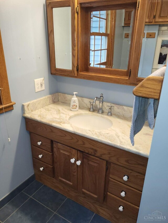 1144 Round Bottom Rd, Union Twp, OH 45150 - bathroom with baseboards, tile patterned flooring, and vanity
