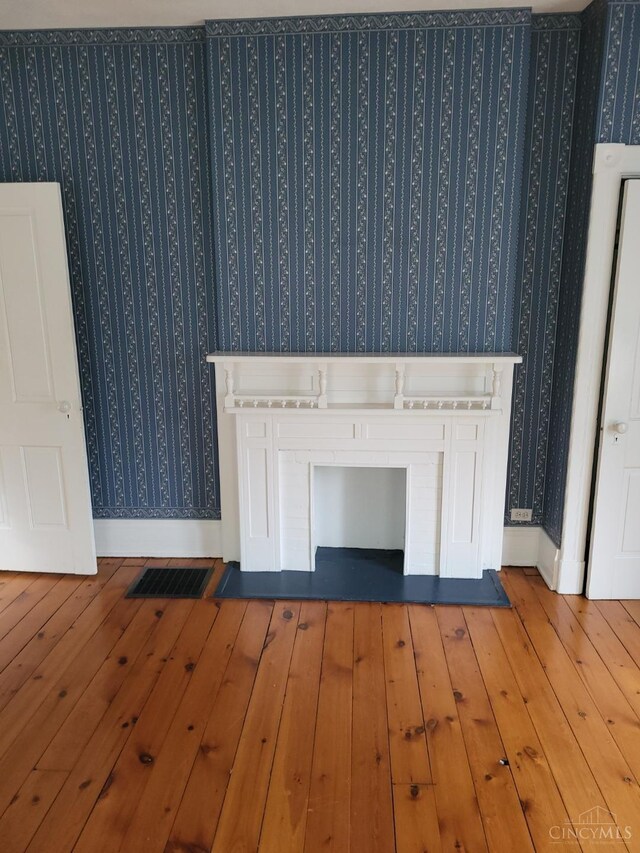 1144 Round Bottom Rd, Union Twp, OH 45150 - interior details with baseboards, visible vents, wood finished floors, and wallpapered walls