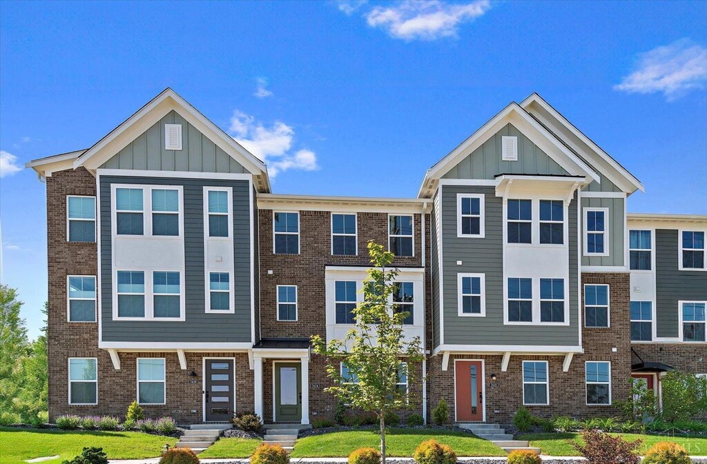 7252 Abington Way Unit 50302, West Chester, OH 45069 - townhome / multi-family property with brick siding, a front yard, and board and batten siding