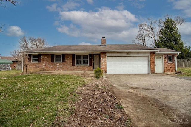 ranch-style house with a front yard, fence, driveway, an attached garage, and brick siding