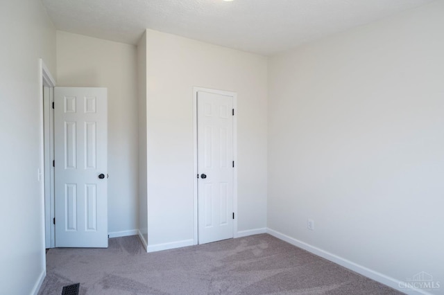 5103 Washburn Rd, Brushcreek Twp, OH 45133 - unfurnished bedroom featuring carpet floors and baseboards