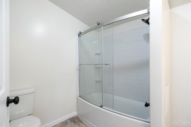 5103 Washburn Rd, Brushcreek Twp, OH 45133 - full bath with toilet, baseboards, and enclosed tub / shower combo