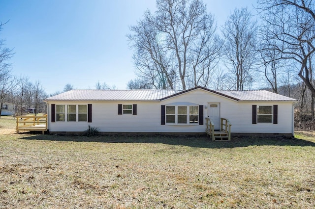 5103 Washburn Rd, Brushcreek Twp, OH 45133 - rear view of house featuring metal roof, a yard, crawl space, and a deck