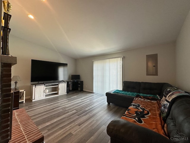living room with electric panel, dark wood-style floors, baseboards, and vaulted ceiling