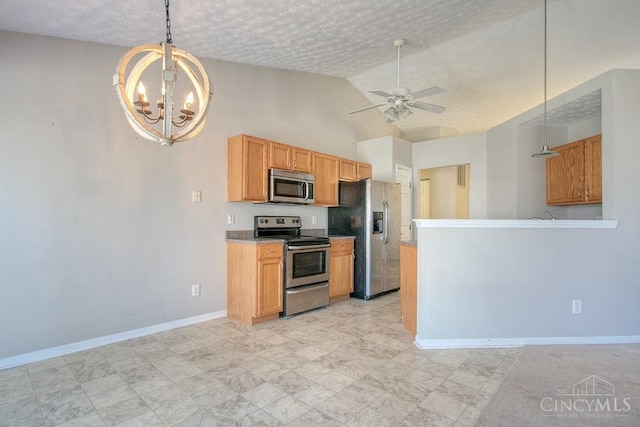 kitchen featuring baseboards, appliances with stainless steel finishes, a textured ceiling, decorative light fixtures, and ceiling fan with notable chandelier