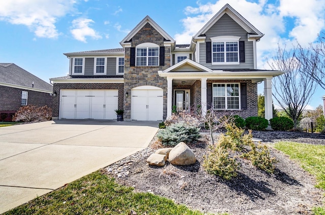 view of front of house with a garage, stone siding, and concrete driveway