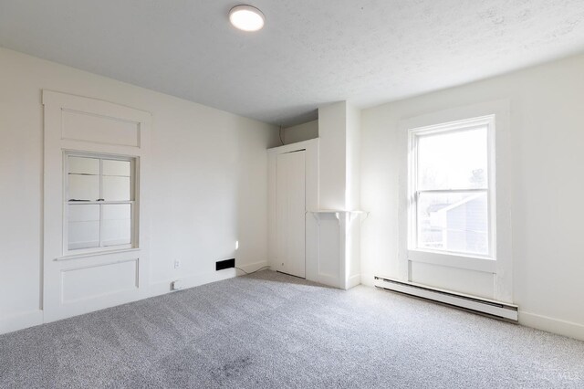 6114 Reily Millville Rd, Reily Twp, OH 45056 - carpeted spare room with baseboard heating and a textured ceiling