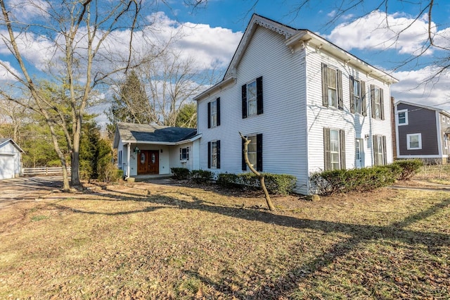 6114 Reily Millville Rd, Reily Twp, OH 45056 - view of side of home with french doors, a lawn, and fence
