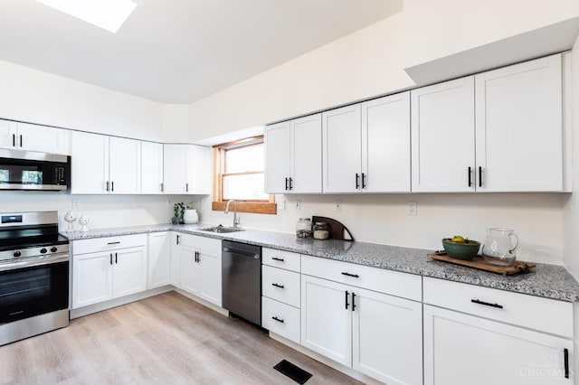 6114 Reily Millville Rd, Reily Twp, OH 45056 - kitchen featuring white cabinets, appliances with stainless steel finishes, and a sink