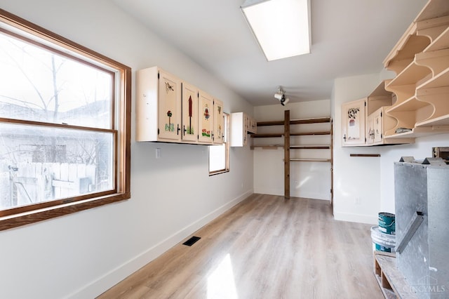 6114 Reily Millville Rd, Reily Twp, OH 45056 - interior space with visible vents, light wood-style flooring, baseboards, and open shelves