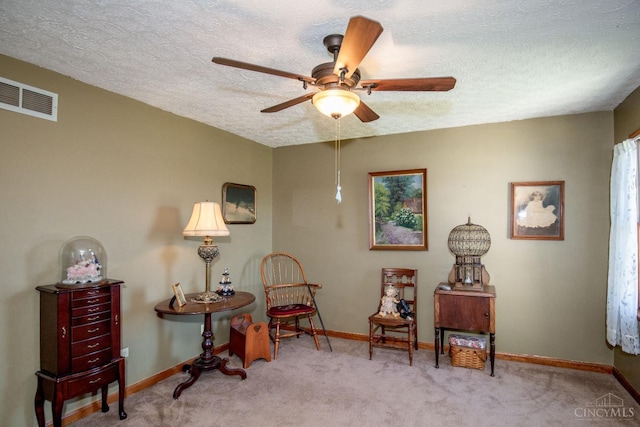 343 Whiteoak Dr, Wilmington, OH 45177 - living area featuring baseboards, a ceiling fan, carpet floors, and a textured ceiling