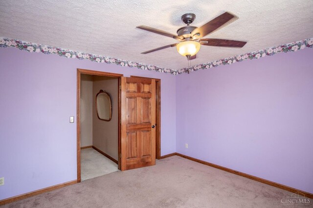 343 Whiteoak Dr, Wilmington, OH 45177 - empty room featuring a textured ceiling, a ceiling fan, light colored carpet, and baseboards