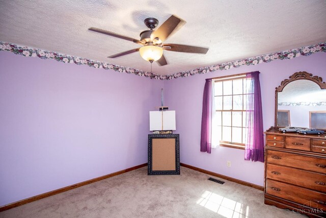 343 Whiteoak Dr, Wilmington, OH 45177 - bedroom featuring a textured ceiling, baseboards, light colored carpet, and ceiling fan