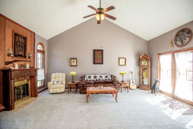 343 Whiteoak Dr, Wilmington, OH 45177 - carpeted living room with a ceiling fan, a fireplace with flush hearth, and high vaulted ceiling