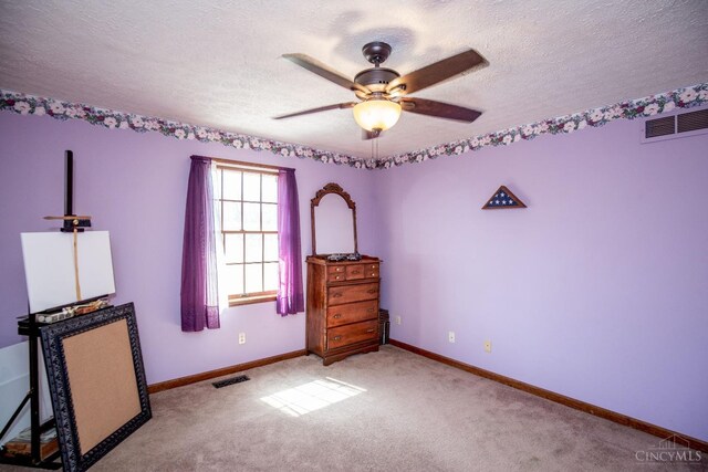 343 Whiteoak Dr, Wilmington, OH 45177 - carpeted bedroom featuring a textured ceiling, baseboards, and a ceiling fan