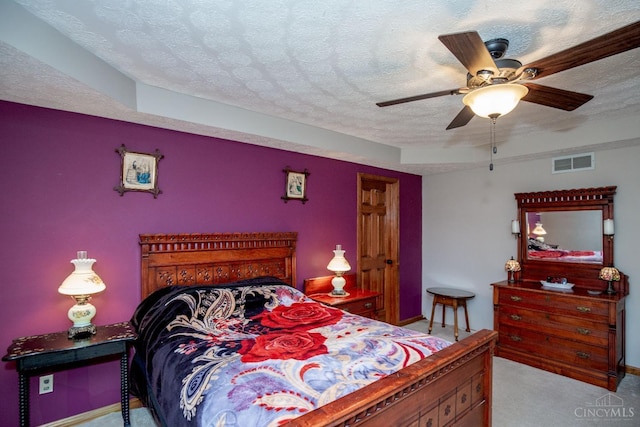 343 Whiteoak Dr, Wilmington, OH 45177 - carpeted bedroom with a textured ceiling, a ceiling fan, and baseboards