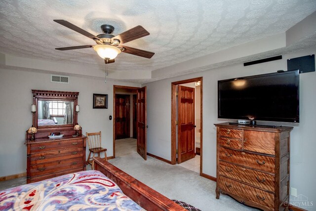 343 Whiteoak Dr, Wilmington, OH 45177 - bedroom featuring baseboards, light colored carpet, a textured ceiling, and ceiling fan